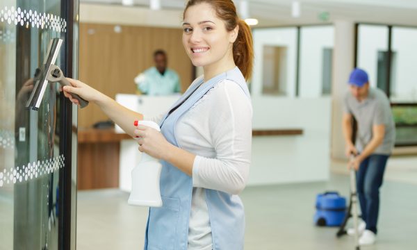 62206469-corporate-office-cleaner-working-cleaning-the-window