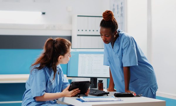 multi-ethnic-team-nurses-looking-digital-tablet-consultation-treatment-diverse-group-medical-assistants-working-with-technology-healthcare-system-checkup